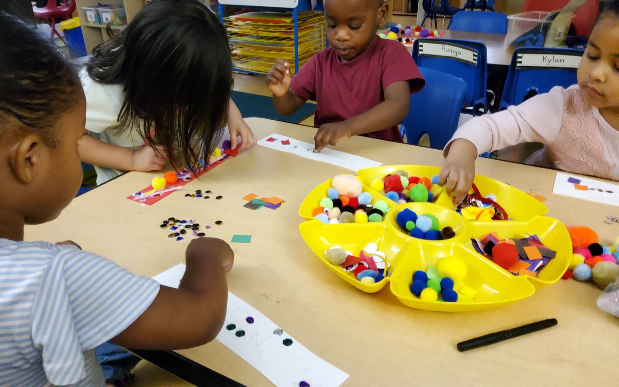 Children at Fingerprints location completing an art project. 
